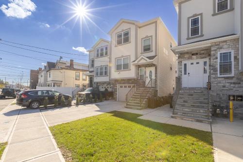 a house with a car parked in front of it at Modern one bedroom apartment in Elizabeth