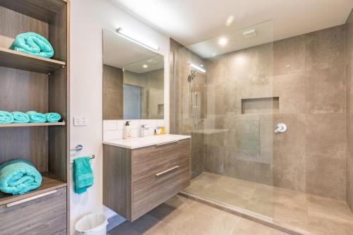 a bathroom with a shower and a sink at Lakeside Escape in Queenstown