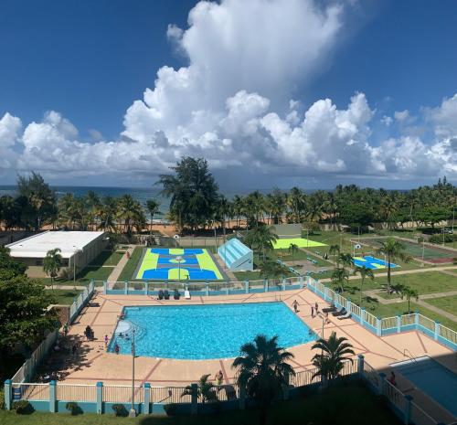 an overhead view of a pool at a resort at Luquillo Beach & Ocean Fresh in Luquillo
