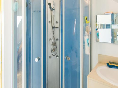 a shower with a glass door in a bathroom at Gîte Ruillé-sur-Loir, 4 pièces, 8 personnes - FR-1-410-134 in Ruillé-sur-Loir