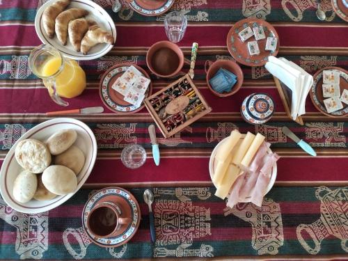 a table topped with plates and bowls of food at Finca Santa Rita in Corralito