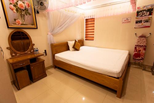 Кровать или кровати в номере Minh Cường Hotel