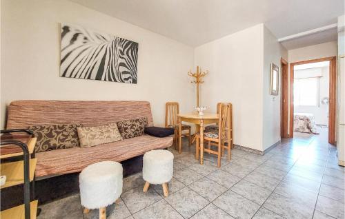 a living room with a couch and a table at 2 Bedroom Nice Apartment In Moncofa in Moncófar