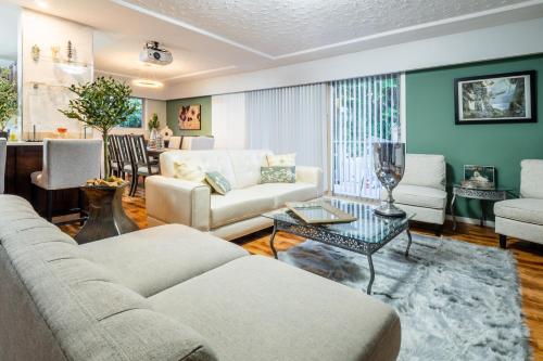 a living room with a couch and a table at NorthVAN nature living home in North Vancouver