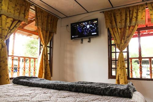 מיטה או מיטות בחדר ב-Apartaestudio con vista a montañas