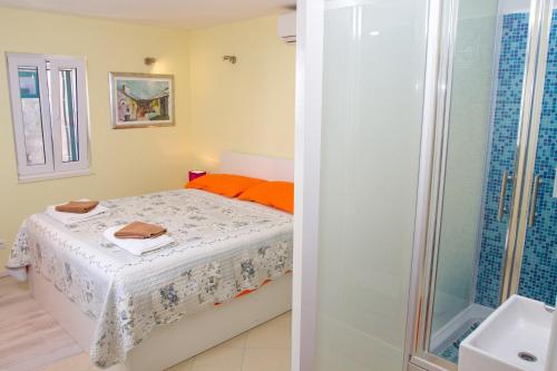 Krevet ili kreveti u jedinici u okviru objekta Apartments & Rooms Toni