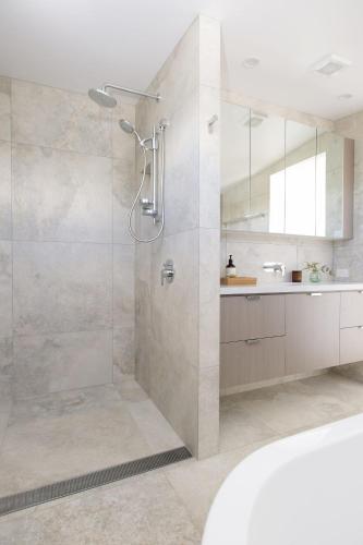 a bathroom with a shower and a sink at Paddle on Seven Mile in Lennox Head