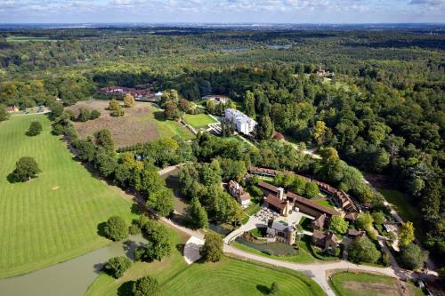 an aerial view of an estate with a large house at Coworth Park - Dorchester Collection in Ascot