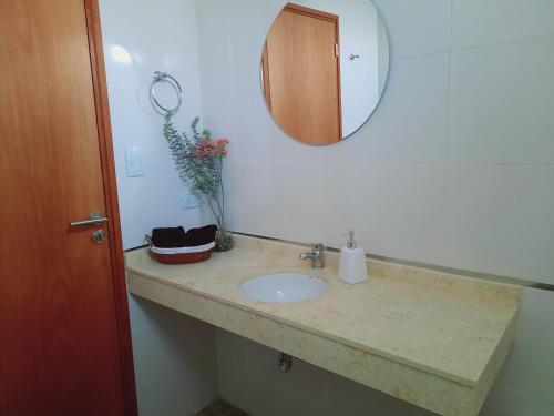 a bathroom counter with a sink and a mirror at Rouse in San Miguel de Tucumán