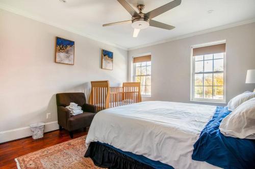 a bedroom with a bed and a ceiling fan at Little Persian Palace with Parking in Washington, D.C.