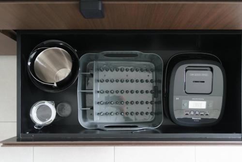 a black box with an electronic device in it at Okinawa Plaisant Villa in Nakadomari