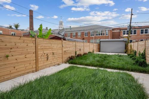 a wooden fence in front of a building at Capitol View 3 Penthouse with Rooftop in Washington