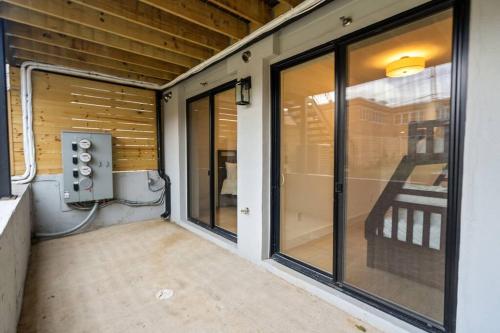 a screened in porch with sliding glass doors at Capitol View 3 Penthouse with Rooftop in Washington