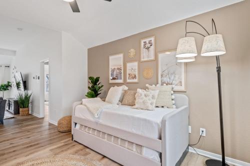 a bedroom with a white bed with pillows at Lake Marble Falls Waterfront, House, Wet Slip, Huge Yard in Marble Falls