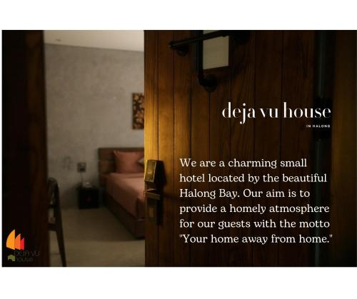 a room with a door with a sign on it at Deja Vu House Ha Long in Ha Long