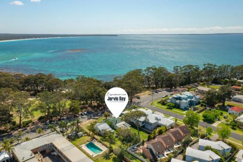 an aerial view of a resort with the ocean at The Gunyah by Experience Jervis Bay in Huskisson