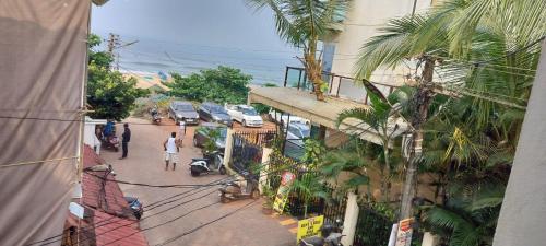 an overhead view of a city street with cars parked at Casa de joana deluxe in Calangute