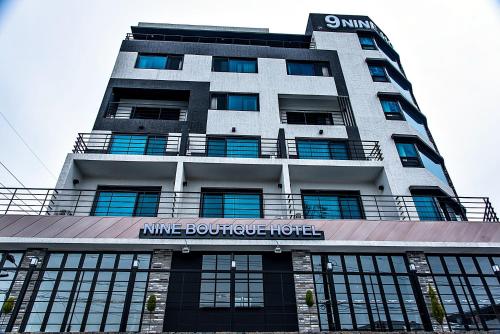 a building with a sign on the front of it at Nine Boutique Hotel in Seogwipo