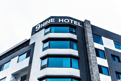 a building with a sign on the top of it at Nine Boutique Hotel in Seogwipo