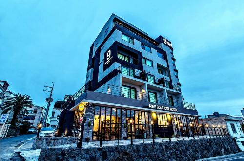 a building on a city street with a building at Nine Boutique Hotel in Seogwipo