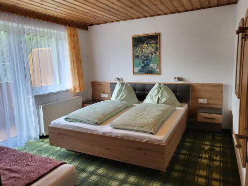 Postel nebo postele na pokoji v ubytování Saumerhof
