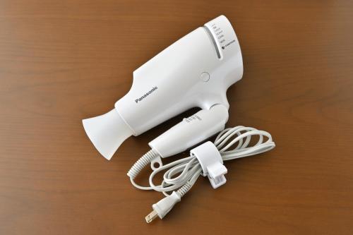 a white hair dryer with a bundle of cords at GRAND BASE Hiroshima Peace Memorial Park in Hiroshima