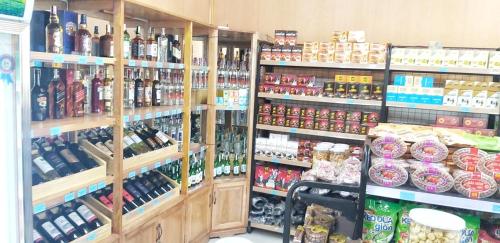 a store filled with lots of bottles of alcohol at A la Carte Ha Long Residences Căn hộ 5 stars cạnh biển in Ha Long