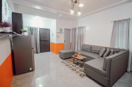 a living room with a couch and a table at RB Modern Condos in Zamboanga