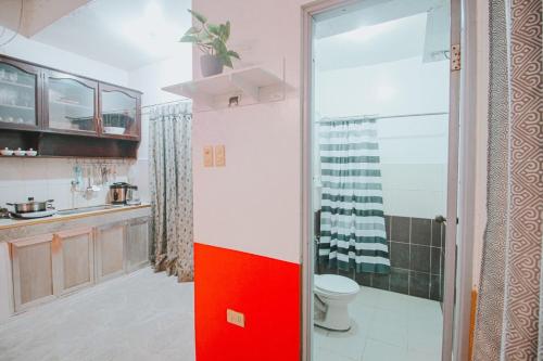 a bathroom with a shower and a toilet in it at RB Modern Condos in Zamboanga