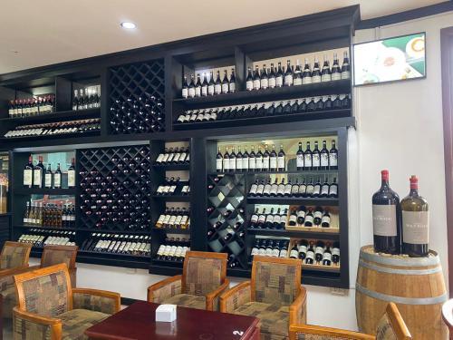 a wine tasting room with a lot of wine bottles at SUBINH HOTEL AND RESTAURANT in Pakse
