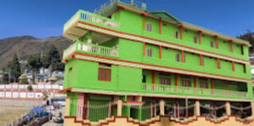a large green building with aventh floor at HOTEL GREEN VIEW BOMDILA,Bomdila in Bomdila