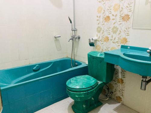 Koupelna v ubytování Just 11 Boutique Syariah Mitra RedDoorz near UGM Yogyakarta