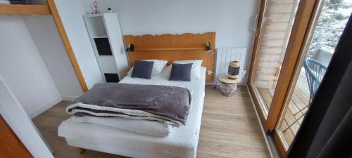 Postel nebo postele na pokoji v ubytování Appartement 4/6 personnes - Vue plein sud - Chamrousse