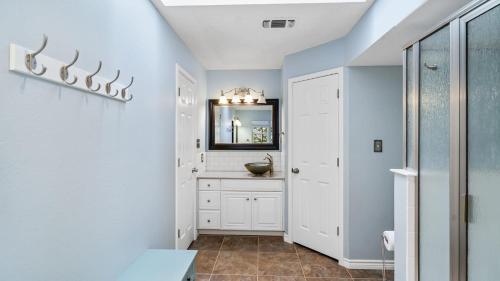 a bathroom with a mirror and a sink at Waterfront House with Amazing Outdoor Oasis Boat Slip and Pet Friendly in Kingsland