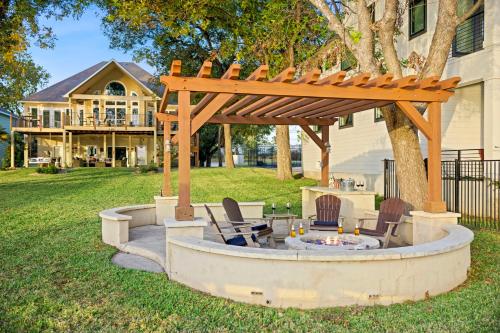 a pergola with chairs and a fire pit in a yard at New Listing - Promo Price Waterfront Huge Yard in Kingsland