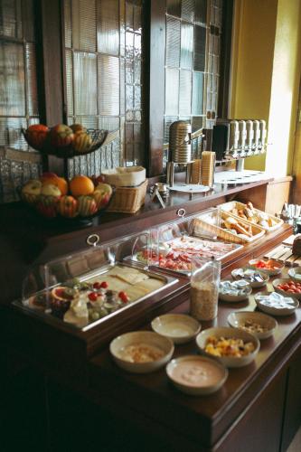 a buffet line with many different types of food at Stadthotel Kleiner Berg in Friedrichshafen