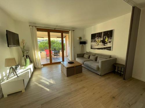 a living room with a couch and a table at Riviera Eden Palace in Cannes