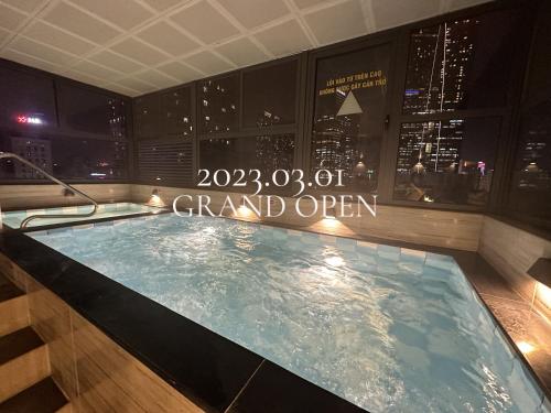 a hot tub with a sign that reads grand open at Hotel Yah Hanoi & Spa in Hanoi