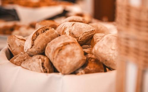 a bunch of donuts sitting in a bowl at Les Violettes Hotel & Spa in Jungholtz