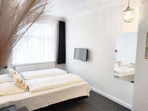 Postel nebo postele na pokoji v ubytování CentralHotellet