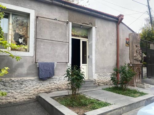 a door of a house with a towel on the window at Paronyan hostel in Yerevan