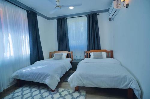 Ένα ή περισσότερα κρεβάτια σε δωμάτιο στο Greenwood Garden 3bedroom Mtwapa