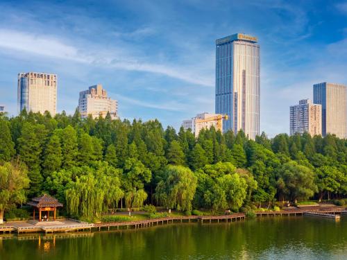 a view of a park with trees and buildings at Shangri-La Nanjing in Nanjing