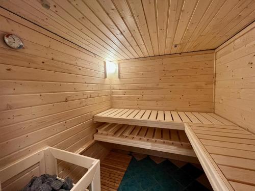 a wooden sauna with a bench in the middle at Altstadt Apartments Melk mit Sauna in Melk