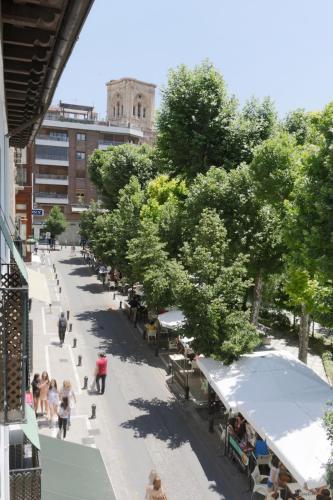 an overhead view of a street with tables and trees at Pension Zurita in Granada