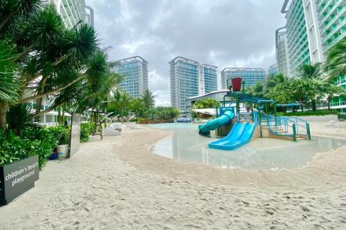 a playground in a resort with a slide at SM Bicutan Condominium in Manila