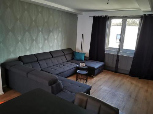 a living room with a couch and a table at Z8 Living in Hannover