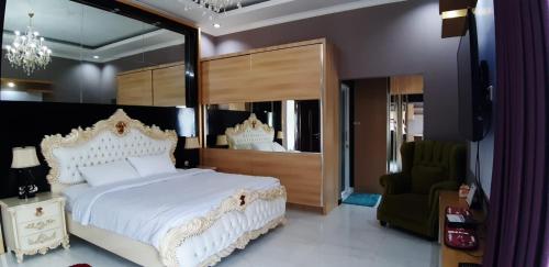 Ένα ή περισσότερα κρεβάτια σε δωμάτιο στο Villa Melati Residence