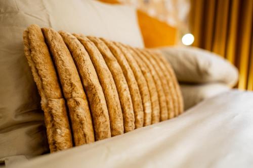 a close up of a blanket on a bed at Boetiekhotel Faan in Ballum