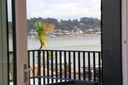 a view of the beach from a balcony at Stylish estuary view apartment in Padstow